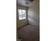 Charming bedroom with carpeted floor and window at 5987 Stone Hollow Ave, Las Vegas, NV 89156