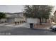 Two-story house with a large tree and two-car garage at 5987 Stone Hollow Ave, Las Vegas, NV 89156