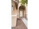 Front entrance with arched entryway and walkway at 5987 Stone Hollow Ave, Las Vegas, NV 89156