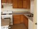 Bright kitchen featuring granite countertops and wood cabinets at 5987 Stone Hollow Ave, Las Vegas, NV 89156