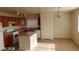 Spacious kitchen with an island, granite countertops, and wood cabinets at 5987 Stone Hollow Ave, Las Vegas, NV 89156