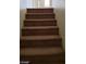 Carpeted staircase leading to the upper level of the home at 5987 Stone Hollow Ave, Las Vegas, NV 89156