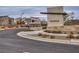 Community entrance with signage and landscaping at 600 N Carriage Hill Dr # 1108, Las Vegas, NV 89138