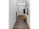 Bright hallway with wood-look flooring and storage bench at 600 N Carriage Hill Dr # 1108, Las Vegas, NV 89138