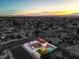 Sunset aerial view of the home, pool, and neighborhood at 6220 Carl Ave, Las Vegas, NV 89108