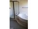 Bathroom with a corner bathtub and shower at 6684 Coronado Crest Ave, Las Vegas, NV 89139