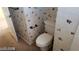 Small bathroom with toilet and floral wallpaper at 6684 Coronado Crest Ave, Las Vegas, NV 89139