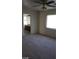 Primary bedroom with bathroom access and ceiling fan at 6684 Coronado Crest Ave, Las Vegas, NV 89139