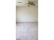 Large bedroom with ceiling fan and neutral walls at 6684 Coronado Crest Ave, Las Vegas, NV 89139