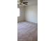 Bright bedroom featuring ceiling fan and carpeted floors at 6684 Coronado Crest Ave, Las Vegas, NV 89139