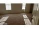 Spacious bedroom with two windows and plush carpeting at 6684 Coronado Crest Ave, Las Vegas, NV 89139