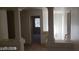 Upper level hallway with columns and access to bedrooms at 6684 Coronado Crest Ave, Las Vegas, NV 89139