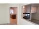 Open kitchen with island, view of living room and fireplace at 6684 Coronado Crest Ave, Las Vegas, NV 89139