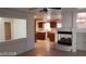 Kitchen with wood cabinets and view to living room at 6684 Coronado Crest Ave, Las Vegas, NV 89139