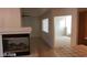 Living area with fireplace and view to sunroom at 6684 Coronado Crest Ave, Las Vegas, NV 89139