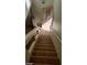 View of carpeted staircase leading to upper level at 6684 Coronado Crest Ave, Las Vegas, NV 89139