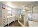 Elegant bathroom with soaking tub and glass shower at 7469 Thornsby Ct, Las Vegas, NV 89120