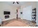 Bright bedroom with ceiling fan, and tile floor at 7711 Gracemoor Ct, Las Vegas, NV 89149