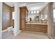 Upscale bathroom with custom cabinets, a spacious vanity, and modern fixtures at 807 Canyon Greens Dr, Las Vegas, NV 89144