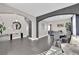 Elegant entryway with a console table and mirror, and views into the dining area at 1204 Airborne Ct, North Las Vegas, NV 89032