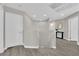 Upstairs hallway with gray flooring and access to bedrooms at 1204 Airborne Ct, North Las Vegas, NV 89032