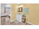 Bathroom featuring a white vanity, framed mirror, and laminate floors with access to the bedroom at 12745 Fairfield Ave, Henderson, NV 89044