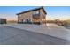 Exterior angle of the home showing the parking area, and a fountain at 12745 Fairfield Ave, Henderson, NV 89044