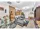 Inviting living room featuring a comfortable gray sectional and modern decor at 12745 Fairfield Ave, Henderson, NV 89044