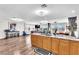Open living space with hardwood floors, a breakfast bar, a foosball table, and expansive windows at 12745 Fairfield Ave, Henderson, NV 89044
