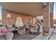 Inviting outdoor patio featuring a fire pit, comfortable seating, and a charming fountain at 12745 Fairfield Ave, Henderson, NV 89044