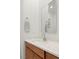 Modern bathroom vanity with quartz countertop and wood cabinets at 177 Cactus Sunrise St, Las Vegas, NV 89138