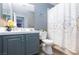 Bathroom with gray vanity and patterned shower curtain at 207 Charter Oak St, Henderson, NV 89074