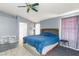 Bright bedroom featuring a king-size bed and an ensuite bathroom at 207 Charter Oak St, Henderson, NV 89074