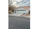 Charming single-story home with a two-car garage, well-maintained landscaping, and a beautiful red tile roof at 207 Charter Oak St, Henderson, NV 89074