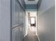 Gray hallway with built-in storage and view to a living area at 207 Charter Oak St, Henderson, NV 89074