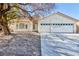 Single-story house with a two-car garage and front yard at 207 Charter Oak St, Henderson, NV 89074