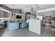 Open kitchen with gray cabinets and granite countertops at 207 Charter Oak St, Henderson, NV 89074