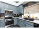 Modern kitchen with stainless steel appliances and gray cabinets at 207 Charter Oak St, Henderson, NV 89074