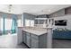 Breakfast bar with granite countertop and gray cabinets at 207 Charter Oak St, Henderson, NV 89074