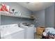 Laundry room with washer, dryer, and shelving at 207 Charter Oak St, Henderson, NV 89074