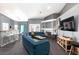 Elegant living room with a curved sectional sofa and fireplace at 207 Charter Oak St, Henderson, NV 89074