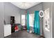 Small home office with window, shelving, and a mini-fridge at 207 Charter Oak St, Henderson, NV 89074