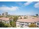 Aerial view showcasing community with Spanish-style homes and city views at 211 E Flamingo Rd # 414, Las Vegas, NV 89169