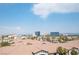 Aerial view of community, featuring Spanish-style homes and city skyline at 211 E Flamingo Rd # 414, Las Vegas, NV 89169