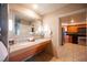 Double vanity bathroom with a view of the kitchen at 211 E Flamingo Rd # 414, Las Vegas, NV 89169