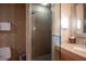Bathroom with a walk-in shower and granite vanity at 211 E Flamingo Rd # 414, Las Vegas, NV 89169