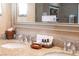 Bathroom featuring double sinks, granite countertops, and upscale toiletries at 211 E Flamingo Rd # 414, Las Vegas, NV 89169