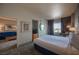 Spacious bedroom with sitting area and view, features a queen bed at 211 E Flamingo Rd # 414, Las Vegas, NV 89169