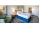 Bedroom with a queen bed, sitting area, and access to bathroom at 211 E Flamingo Rd # 414, Las Vegas, NV 89169