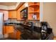 Modern condo kitchen, wood cabinets, granite counters at 211 E Flamingo Rd # 414, Las Vegas, NV 89169